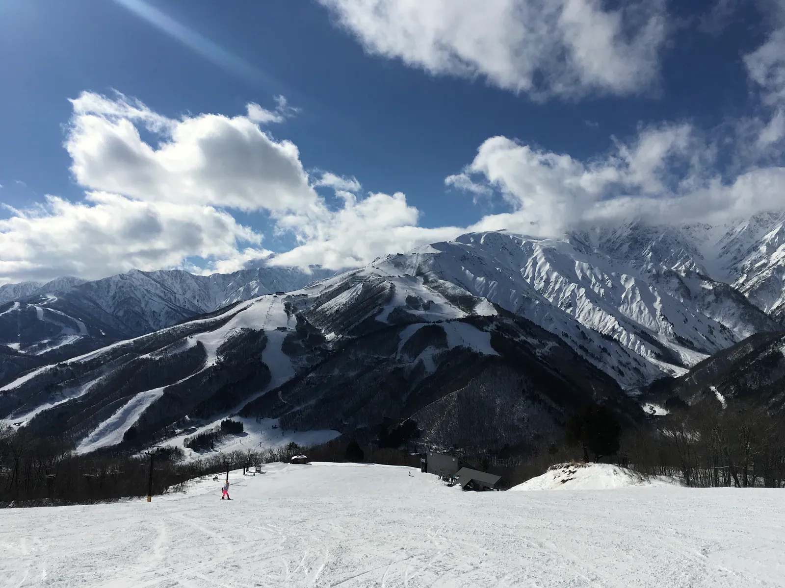 Snowy ski mountain under clouds in Nagano