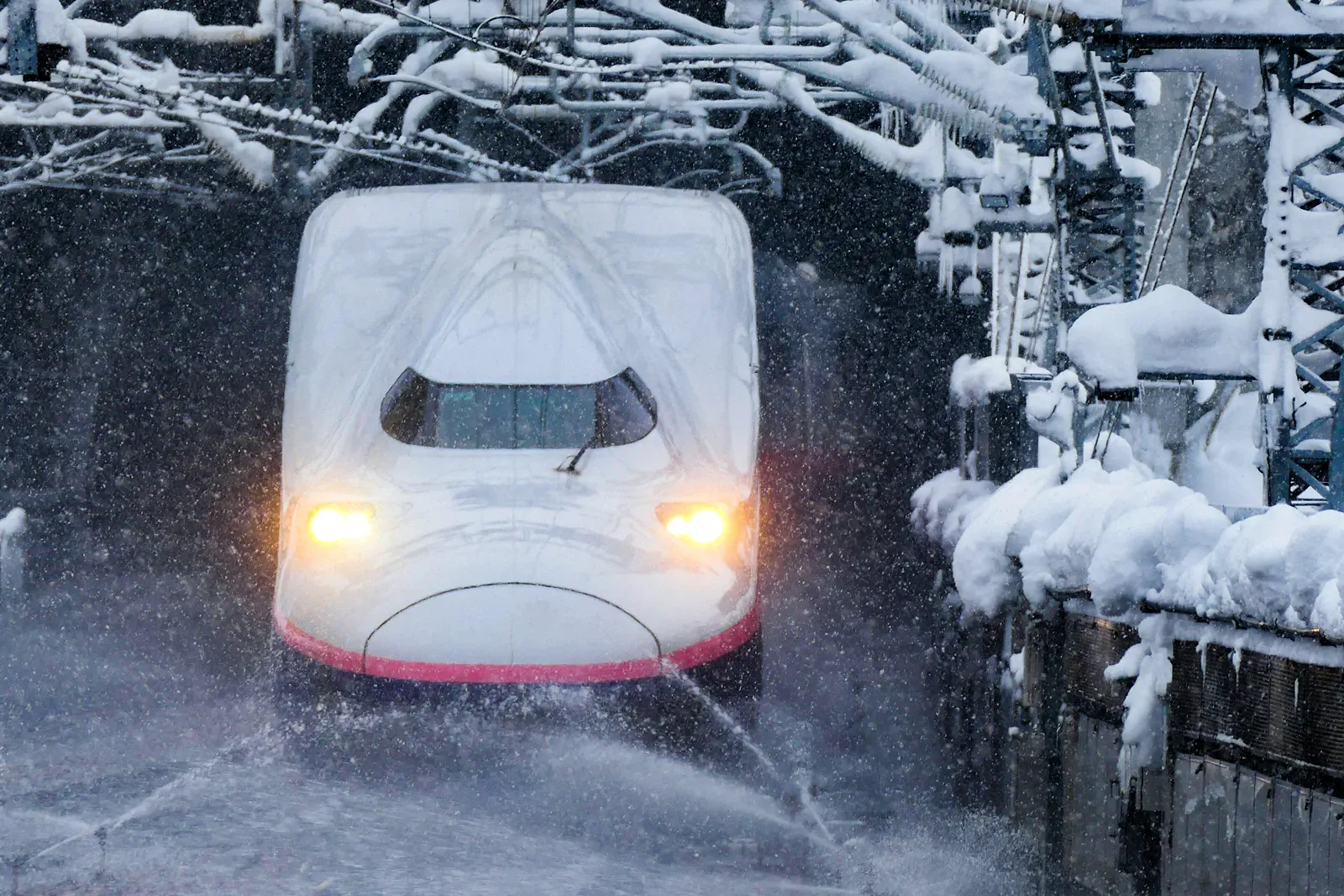 Shinkansen train in falling snow in Niigata
